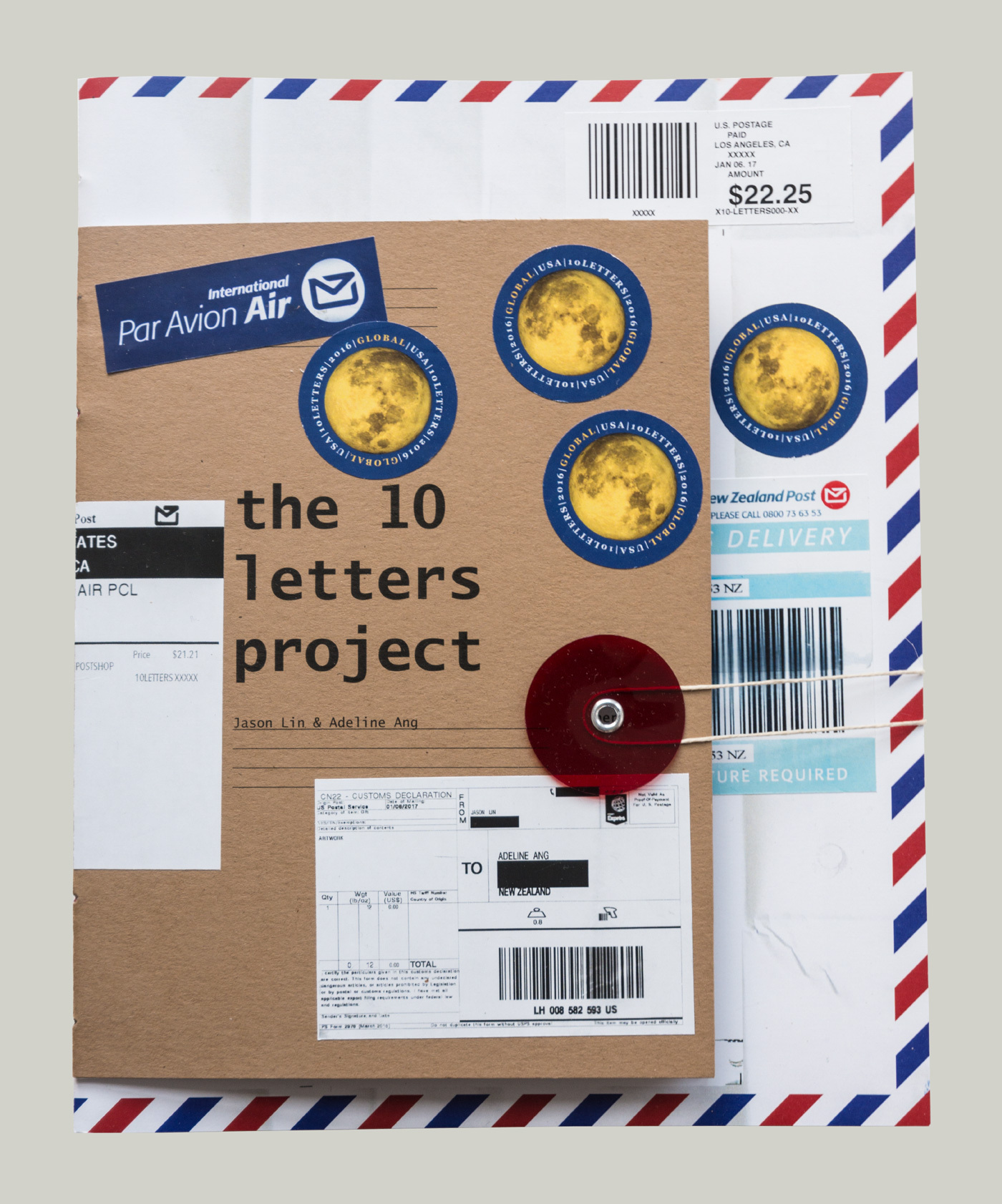 Cover of the book "The 10 Letters Project" by Jason Lin and Adeline Ang. The cover has many mailing stickers pasted on it including U.S.A. international stamps and customs declaration forms. The book is bound with a string closure.