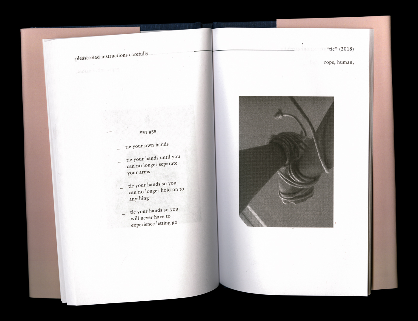 interior spread of the book "Seeds of a Grapefruit" with an image of two hands tied together