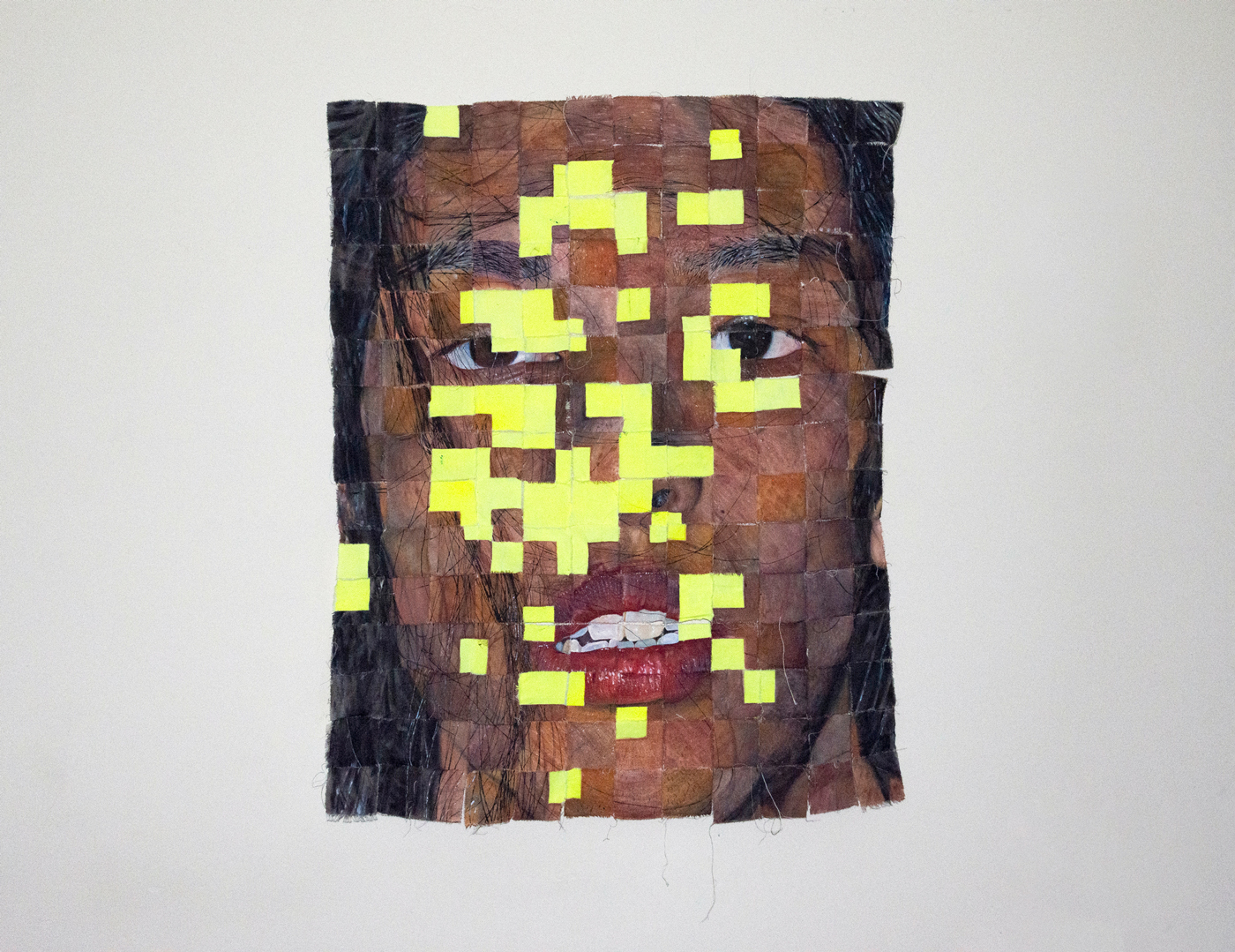 a self-portrait of the artist painted on 180 squares stitched together. various squares of bright yellow mask the face