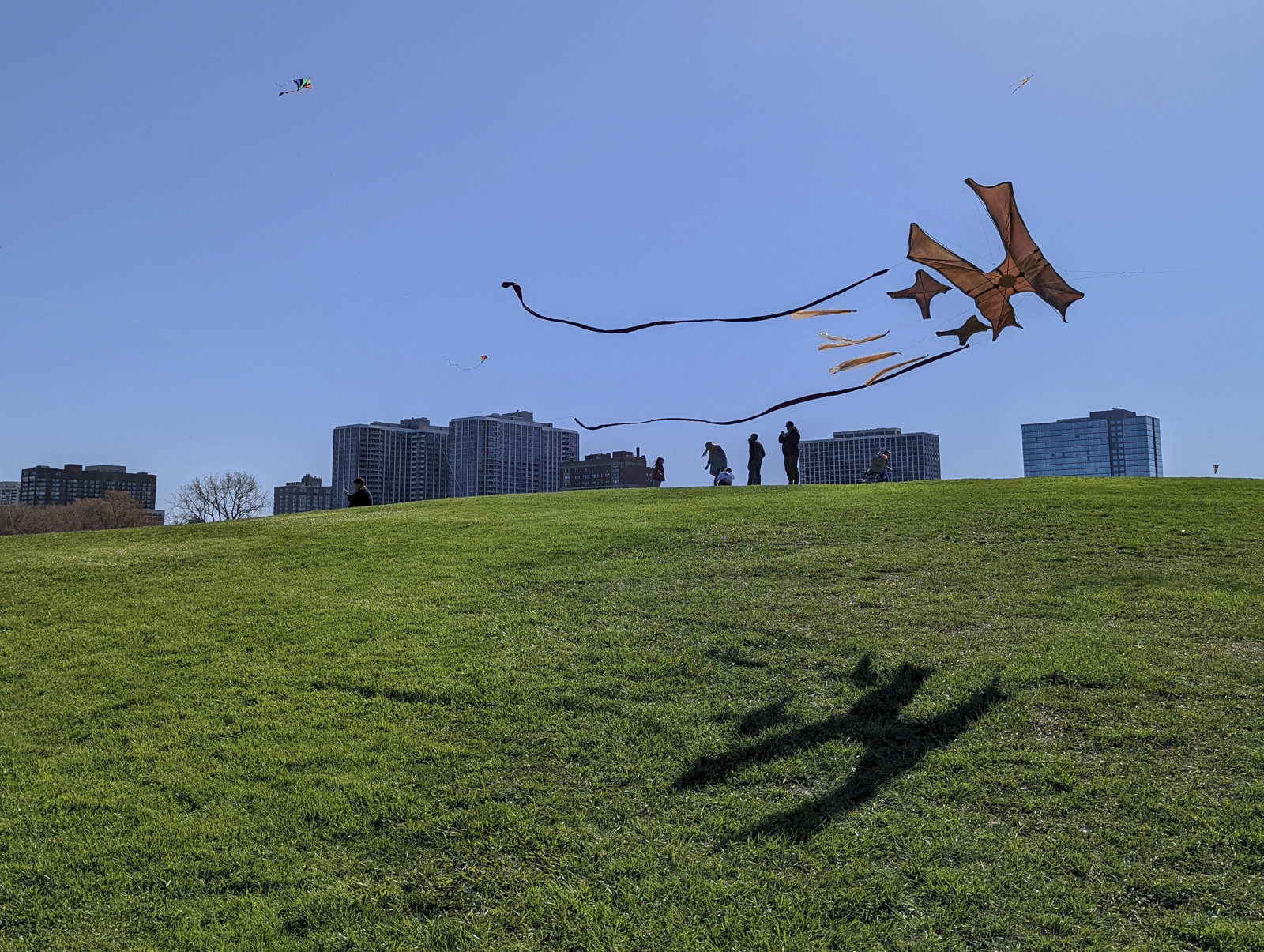 A kite flies horizontally across the sky.